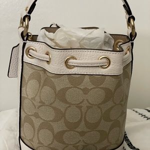 Coach Dempsey Bucket Bag 15 In Signature Canvas With Heart Charm.